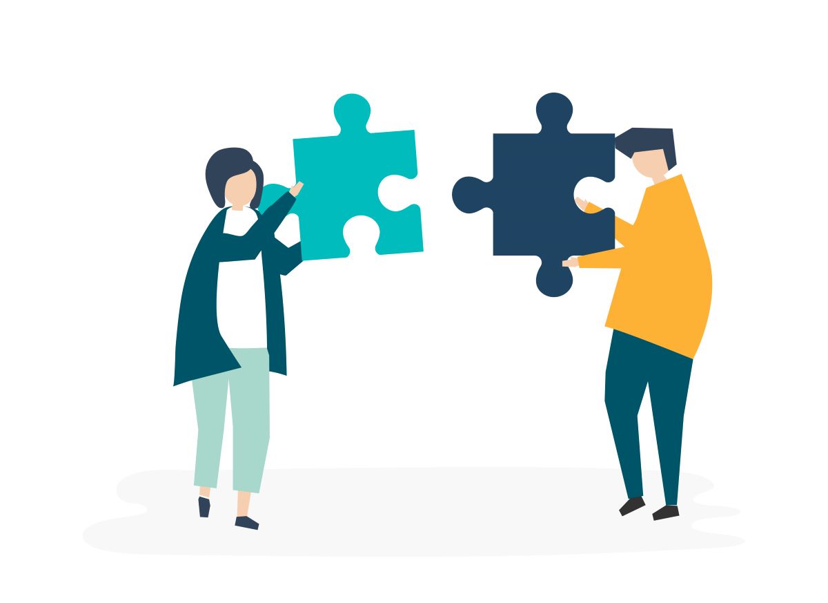 Team teaching in an ESL classroom two people with puzzle pieces